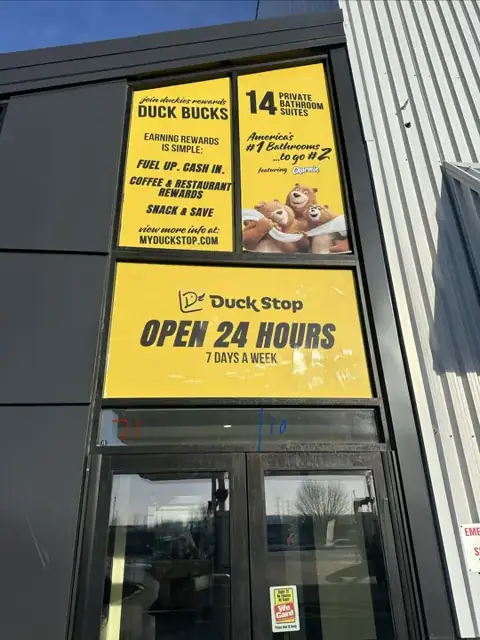 Window graphics for Duck Stop: entrance door and transom graphics. Installed by Sheridan Print in the Chicago area.