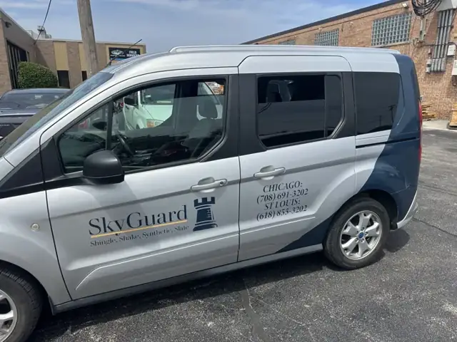 Van graphics for SkyGuard Roofing: matching graphics on the skyguard fleet van. Installed by Sheridan Print in the Chicago area.