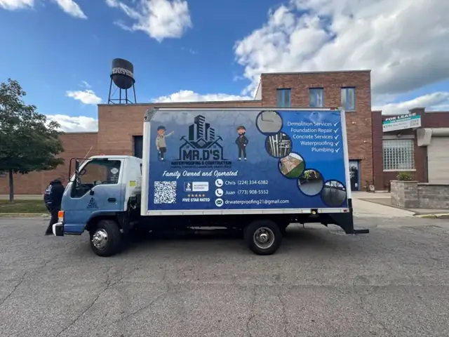 Box truck wrap for Mr. D's Waterproofing: box truck with brand characters, service list, phone numbers, and qr code. Installed by Sheridan Print in the Chicago area.