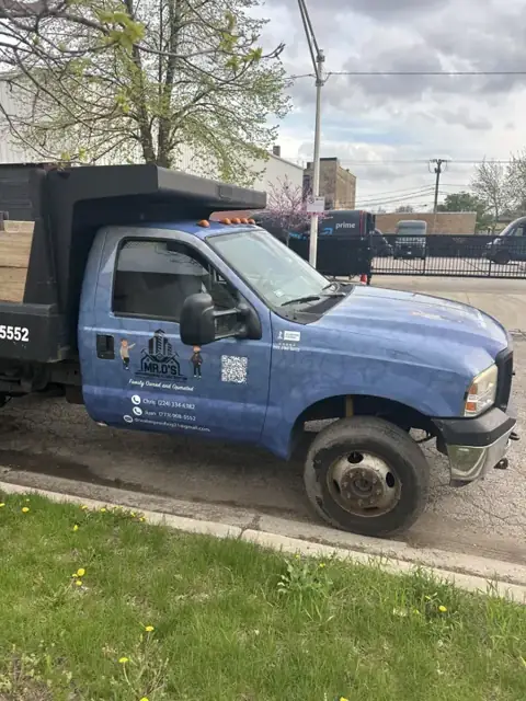 Dump truck wrap for Mr. D's Waterproofing: ford f-series dump truck in the same blue fleet look. Installed by Sheridan Print in the Chicago area.