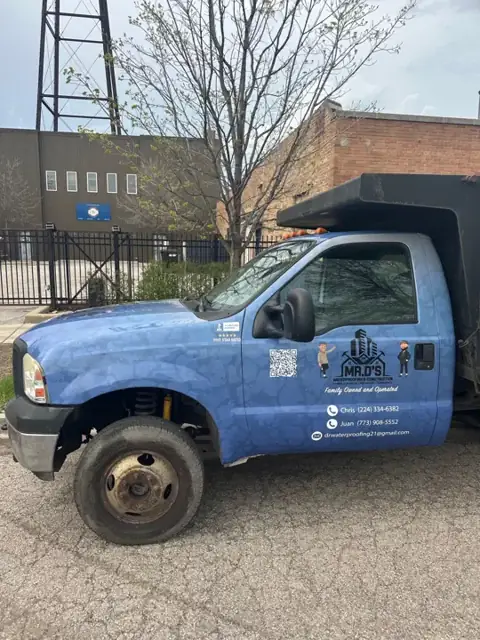 Dump truck wrap for Mr. D's Waterproofing: cab doors with logo, qr code, and contact details. Installed by Sheridan Print in the Chicago area.