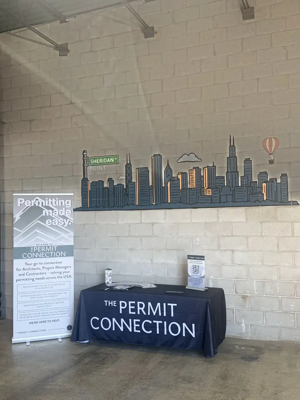 Event printing for The Permit Connection: trade show banner, table cover, and printed handouts. Installed by Sheridan Print in the Chicago area.